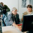 An NBC news crew works with Thomas Cahill (middle) last week on campus, reviewing his Ground Zero research.