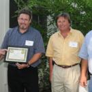 Chancellor Larry Vanderhoef and the Energy Management Team: Fred Haynes, Mark A. Nicholas and Mark D. Nicholas. 