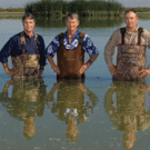 Peter Stent, center, and other donors established an endowed professorship to support the research of John Eadie, left, and his students. Shaun Oldenburger 08, right, is now a state wildlife biologist.