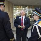 Photo: Student Affairs Vice Chancellor Fred Wood chats with members of the Cal Aggie Marching Band-uh! during Fall Convocation 2008.