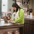 A student shopping for a laptop computer.