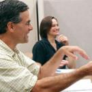 Dave Smart, left, a professor of viticulture and enology, and Victoria Cross, a program coordinator with the Teaching Resources Center, talk about better teaching strategies and techniques with other faculty members during a Lecture Club group d