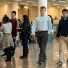 Kevin Blue walks with student in Memorial Union.