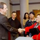 Jerry Kissler of the UC Office of the President greets Linda Mijangos, a program manager for the College of Agricultural and Environmental Sciences, after addressing the Staff Assembly.