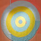 Photo: Marie Watt's "Flag" wallhanging (reclaimed wool blankets, satin binding, thread), resembling a bull's-eye, 2004