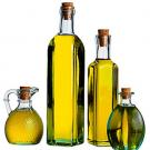Photo: olive oil in four glass bottles