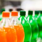 a row of large soda bottles