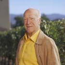 Photo: Robert Mondavi with vineyardin background