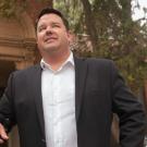 Mike Webb stands in front of the Davis City Hall