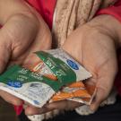 Researcher holding nutritional supplements