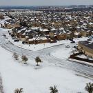 Austin suburb seen from above with snow on the streets