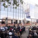 Crowd listens to speech at Aggie Square.