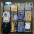 An in-store display of clothing and accessories available at UC Davis Stores both online and in person.