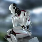Photo illustration of a humanoid robot sitting in a classical thinking position, reminiscent of the Rodin sculpture.