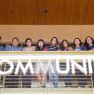 A group of students look over a railing at the UC Davis Cross Cultural Center