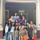 A group of women smile in front of South Hall