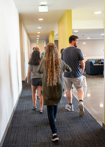 Four resident advisors in hallway