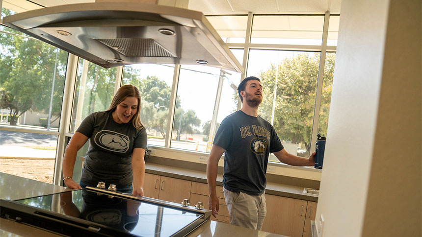 Two students in the common kitchen