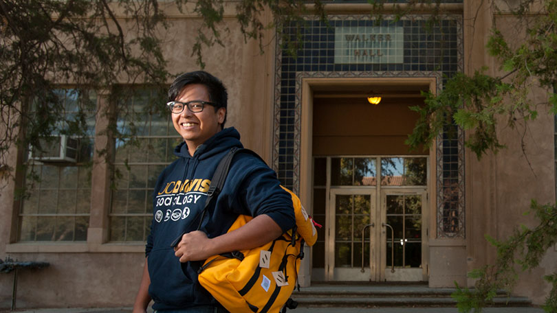 Roy Taggueg in front of Walker Hall